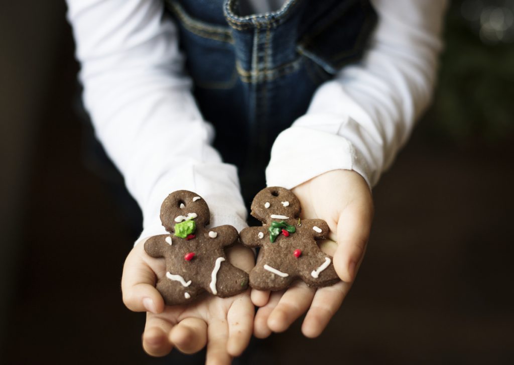 Hands holding Christmas cookies