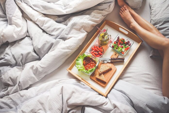 Healthy food laying on a bed