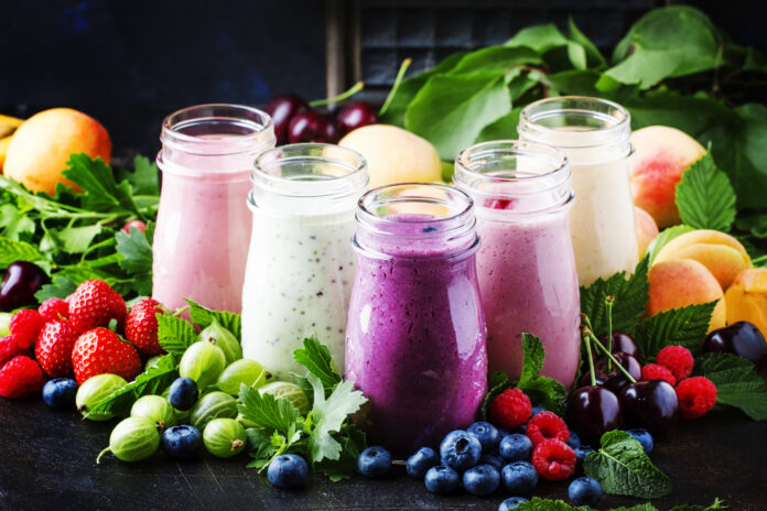 Healthy and useful colorful berry cokctalis, smoothies and milks