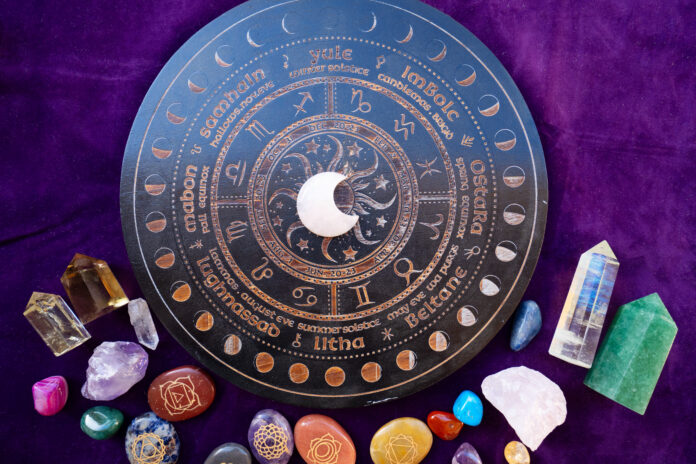 Healing crystals on brown background